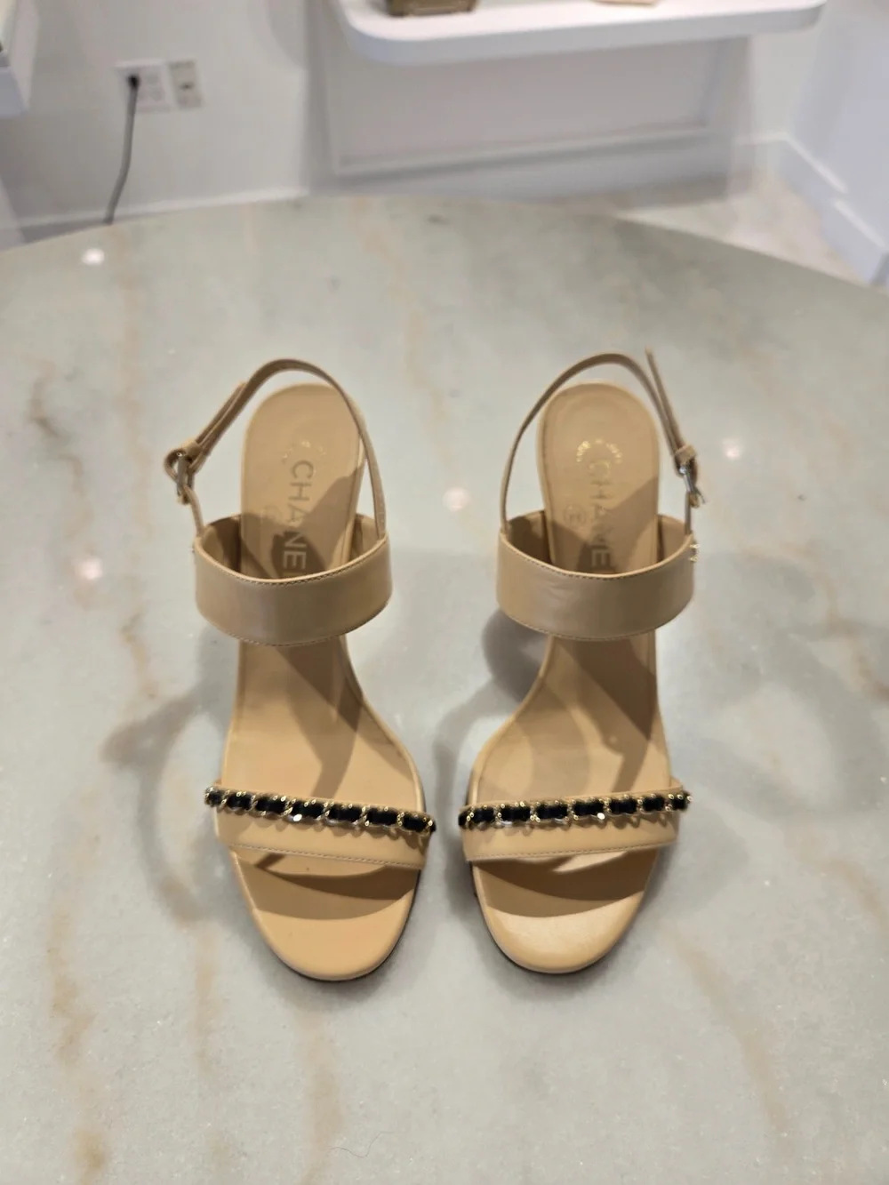 CHANEL Beige Slingback Heels with Black-and-Gold Chain